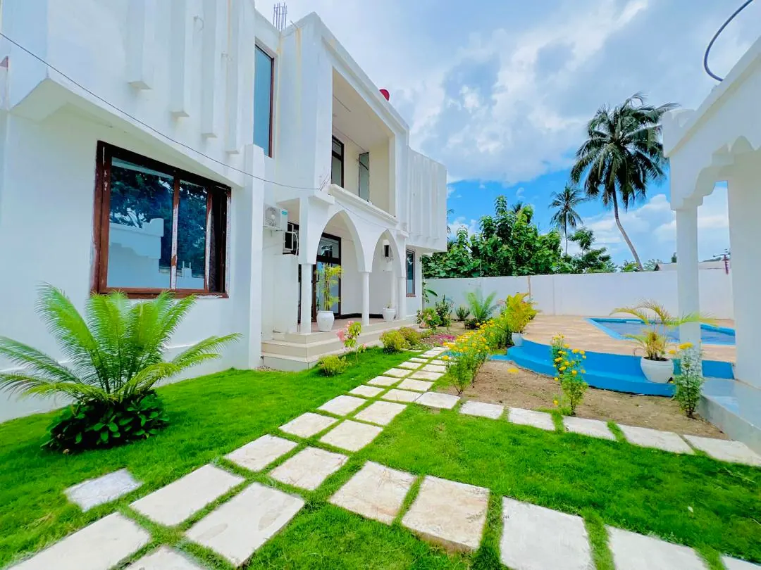 Zanzibar villa exterior with private pool and tropical garden