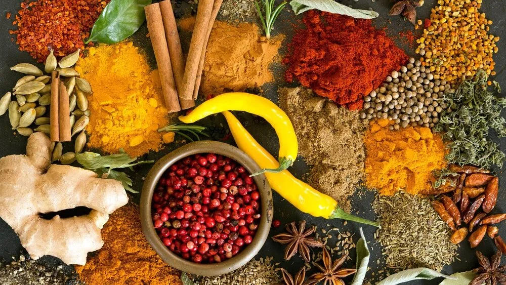 Spices including cinnamon, star anise, ginger and peppercorns