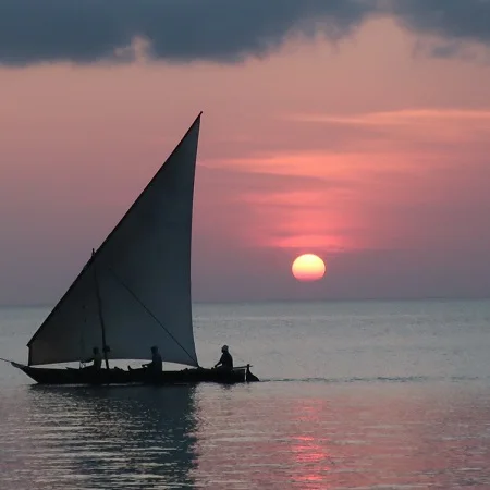 Dhow sailing at sunset off Zanzibar